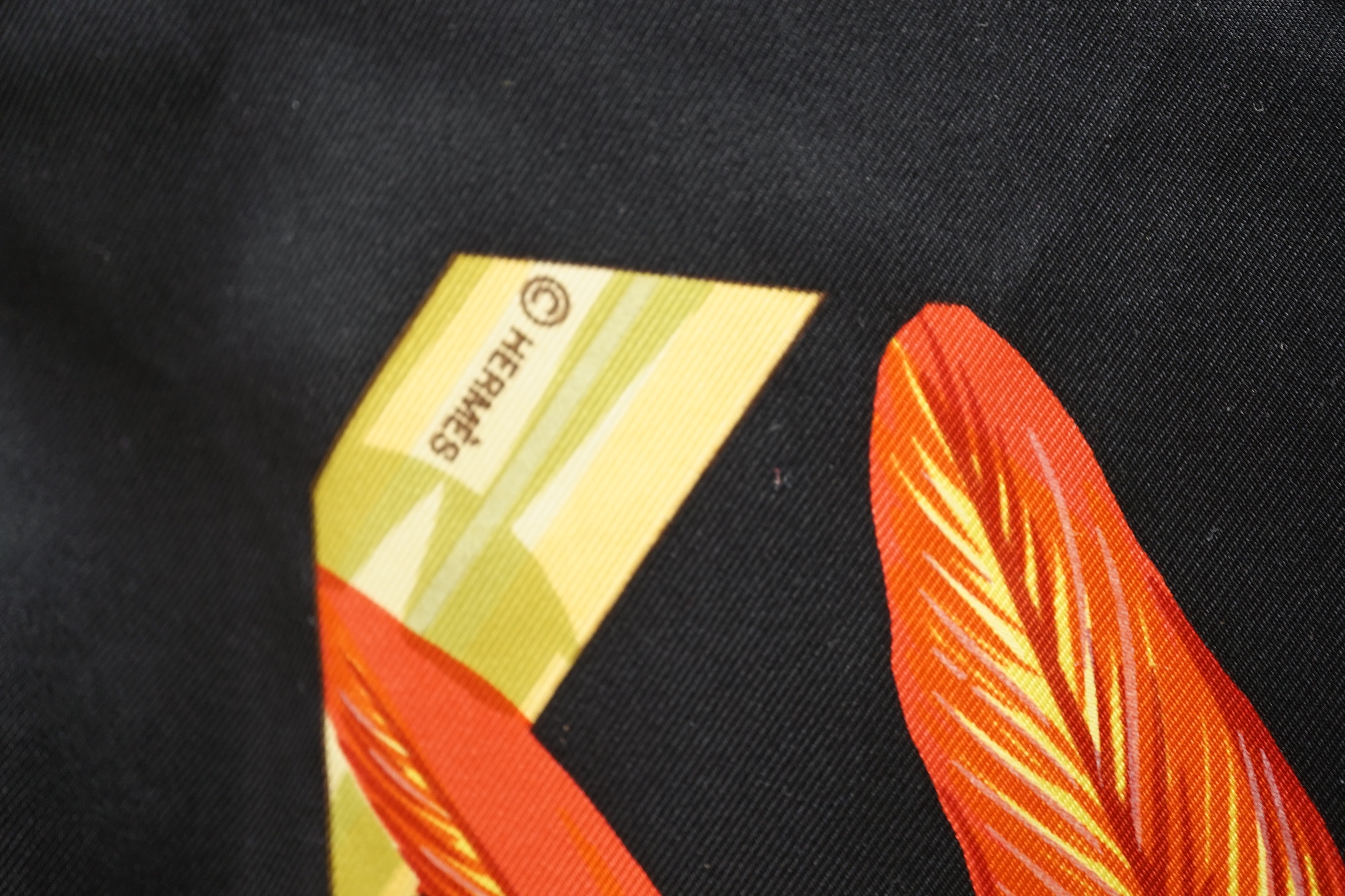 A Hermes silk scarf, ‘’Brazil’’, designed by Laurence Bourthoumieux, 1988, 90cms. square, with original box